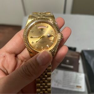 Holuns Mens Watch gold new . With calendar date and day